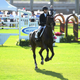 Georgina Bloomberg competing at Donald Trump’s Mar-a-Largo Club in 2015. Image via Getty.
